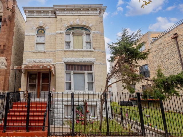 1351 N Campbell Ave, Chicago, IL 60622 - italianate home with brick siding and a fenced front yard