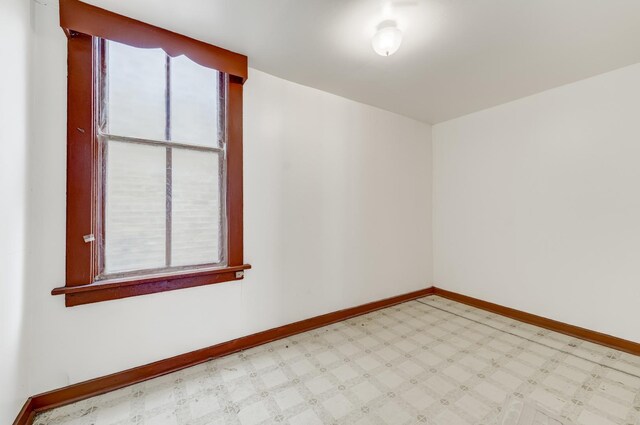 1351 N Campbell Ave, Chicago, IL 60622 - spare room featuring tile patterned floors and baseboards