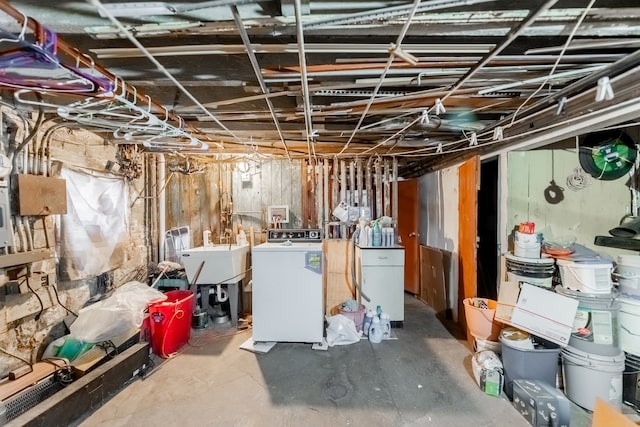 basement featuring washer / clothes dryer and sink