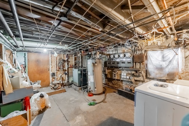 basement featuring washer / clothes dryer and water heater