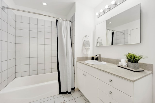 bathroom with tile patterned floors, vanity, and shower / bath combo