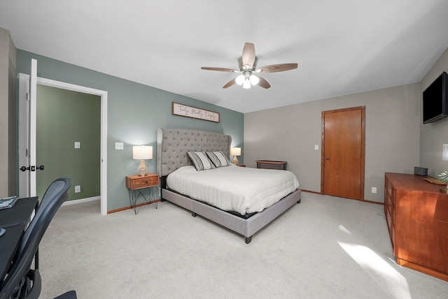 bedroom featuring ceiling fan and light carpet