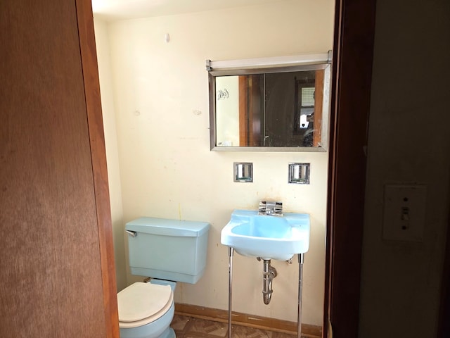 bathroom with toilet and sink