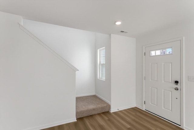 foyer entrance with hardwood / wood-style floors