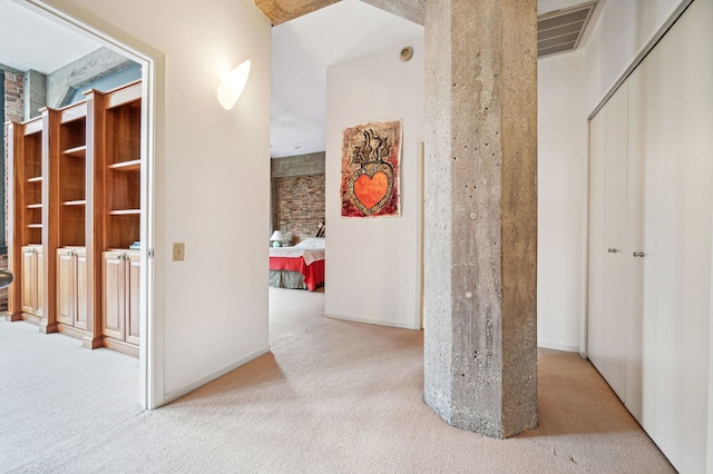 corridor featuring carpet floors and visible vents