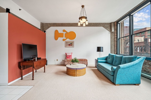 living area with expansive windows, baseboards, and carpet flooring