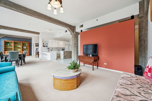 living area featuring visible vents, beamed ceiling, light carpet, and baseboards