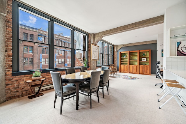 dining area with carpet floors, beamed ceiling, and brick wall