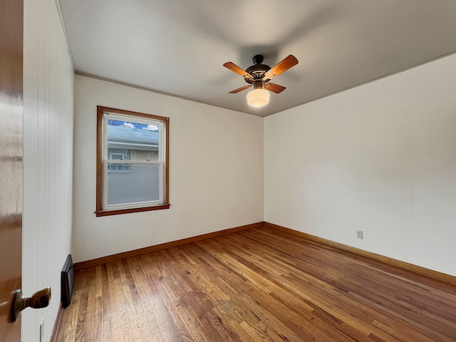 unfurnished room featuring ceiling fan and hardwood / wood-style flooring