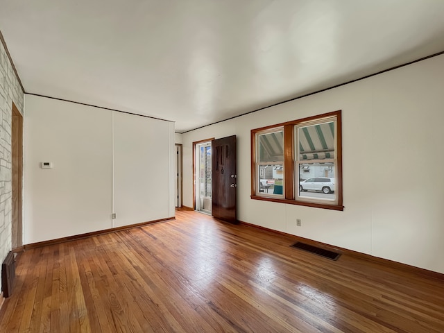 empty room featuring hardwood / wood-style floors