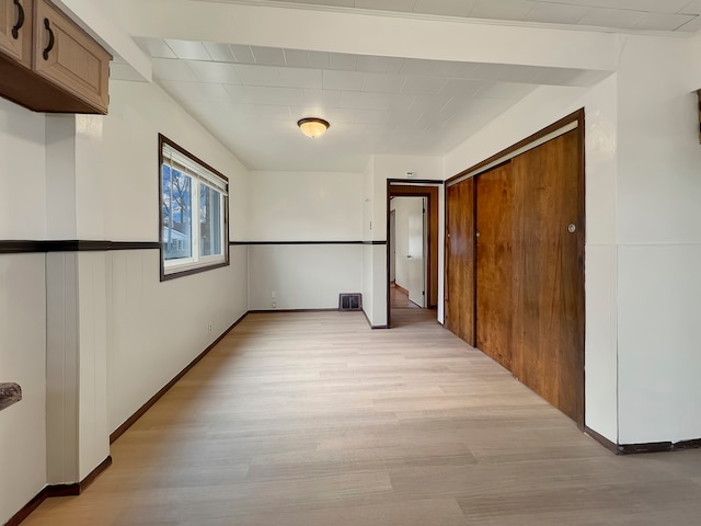 corridor featuring light hardwood / wood-style floors