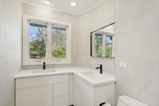 bathroom with tile walls and a wealth of natural light