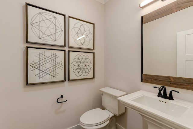 bathroom featuring toilet and sink