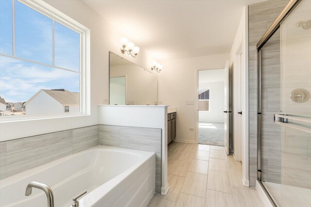 bathroom with a bath and vanity