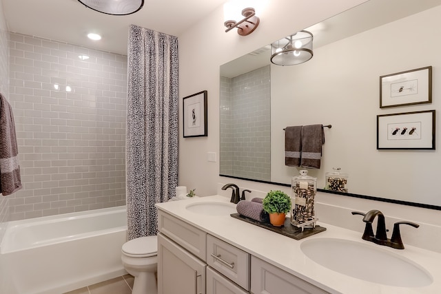 full bathroom featuring tile patterned flooring, vanity, toilet, and shower / bathtub combination with curtain