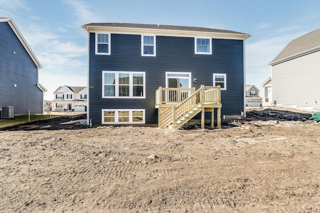 back of house with a deck, central AC unit, and stairs