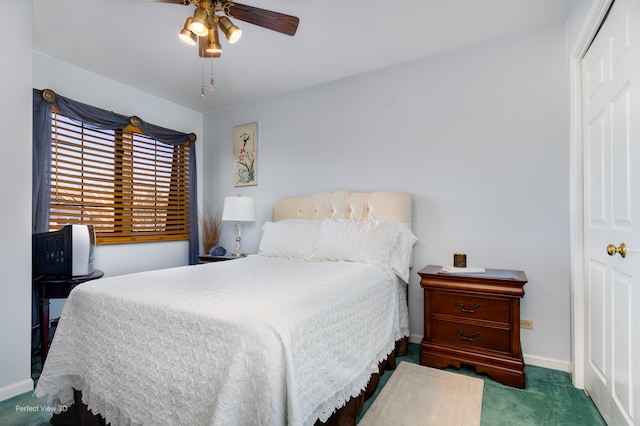 carpeted bedroom featuring ceiling fan and a closet