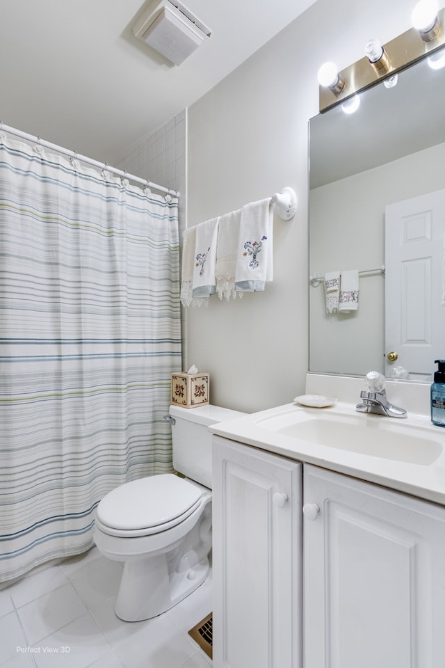 bathroom featuring tile patterned flooring, vanity, a shower with shower curtain, and toilet