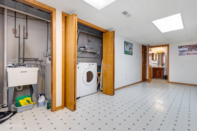 laundry room featuring washer / dryer and sink