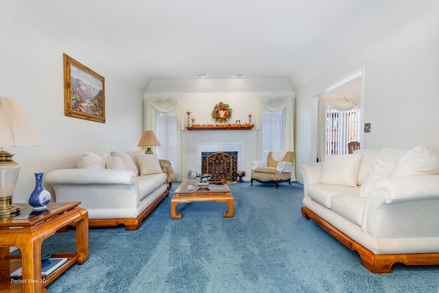 carpeted living room with lofted ceiling