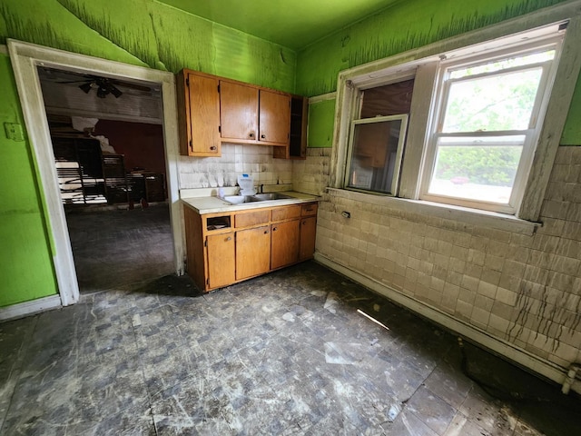7952 S Langley Ave, Chicago, IL 60619 - kitchen with light countertops, brown cabinetry, and a ceiling fan