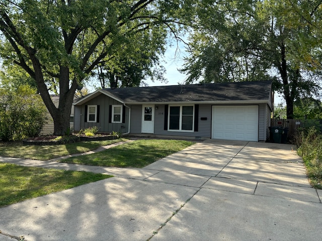 ranch-style home with a front lawn and a garage