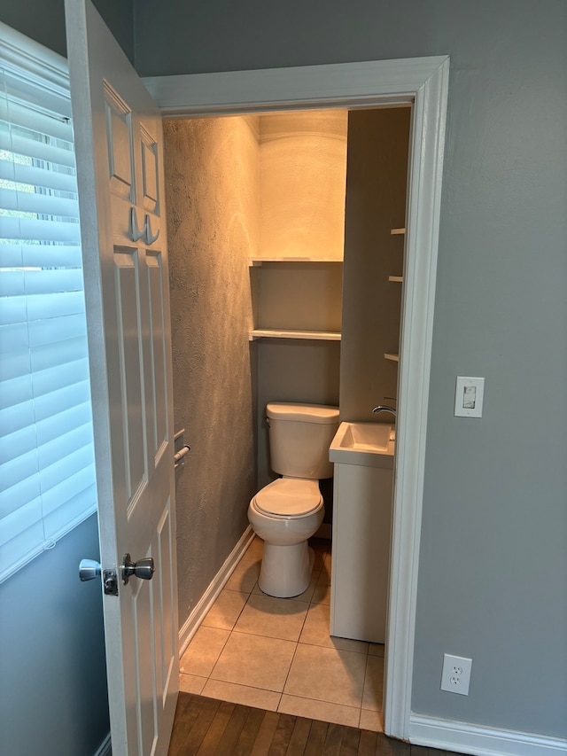 bathroom featuring tile patterned floors and toilet