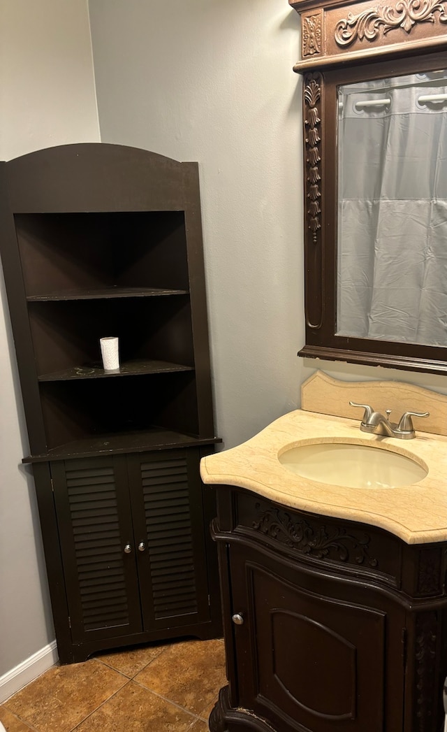 bathroom featuring tile patterned floors and vanity