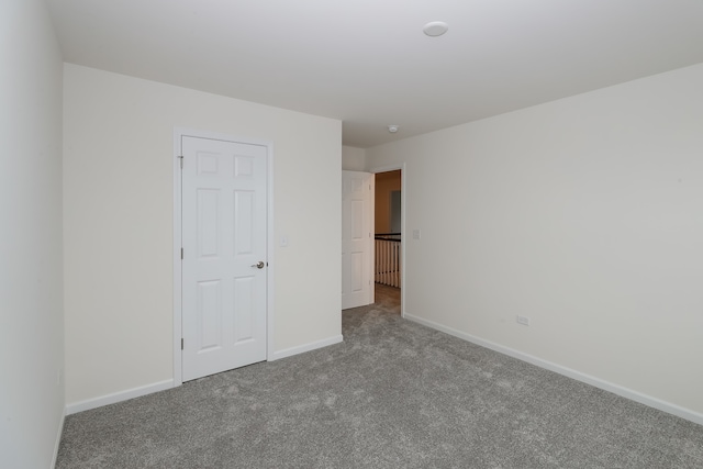 unfurnished bedroom with carpet flooring