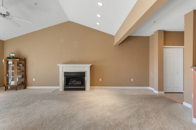 unfurnished living room featuring a fireplace with flush hearth, light colored carpet, a ceiling fan, recessed lighting, and lofted ceiling