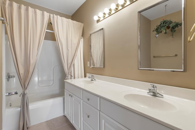 bathroom featuring tile patterned floors, double vanity, shower / tub combo, and a sink