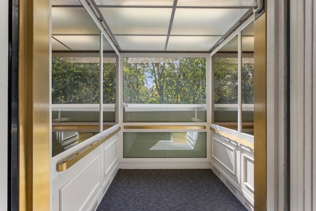 unfurnished sunroom with a wealth of natural light