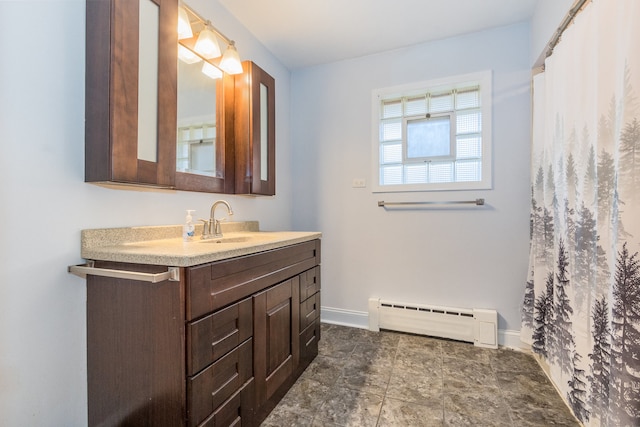 bathroom with vanity and a baseboard heating unit