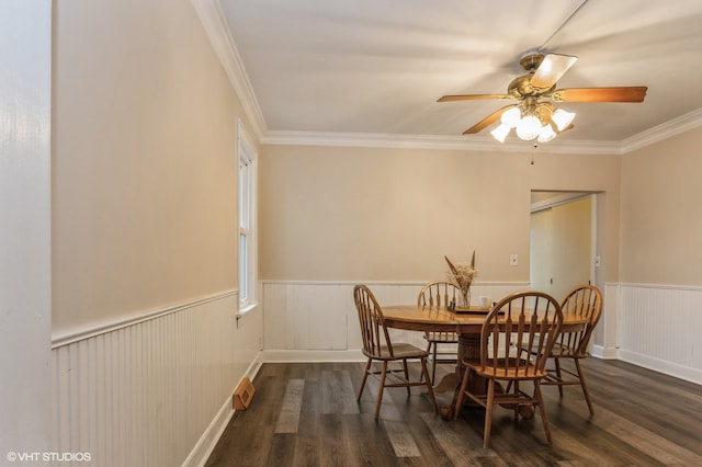 dining room featuring ornamental molding, ceiling fan, and dark wood-type flooring