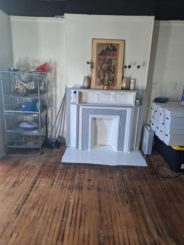 unfurnished living room featuring hardwood / wood-style flooring