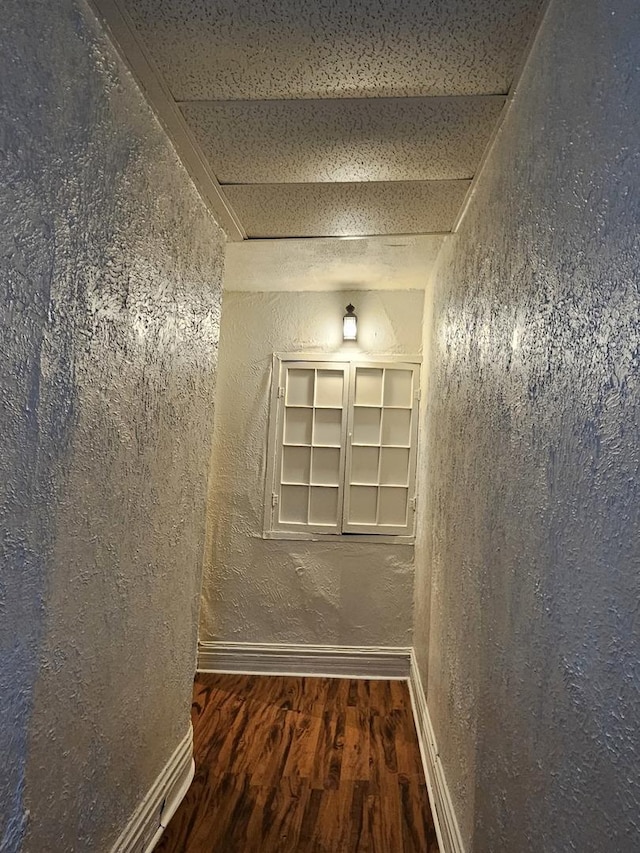 corridor featuring dark hardwood / wood-style floors