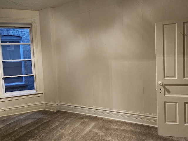 empty room with carpet flooring