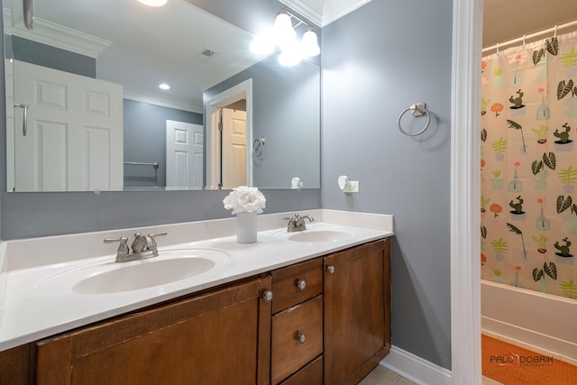 bathroom featuring a sink, visible vents, ornamental molding, and double vanity