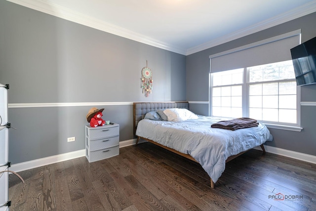 bedroom with wood finished floors, baseboards, and ornamental molding