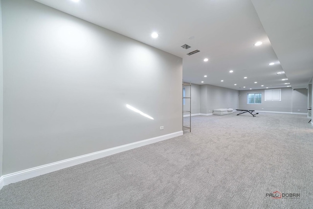 below grade area featuring recessed lighting, visible vents, carpet floors, and baseboards