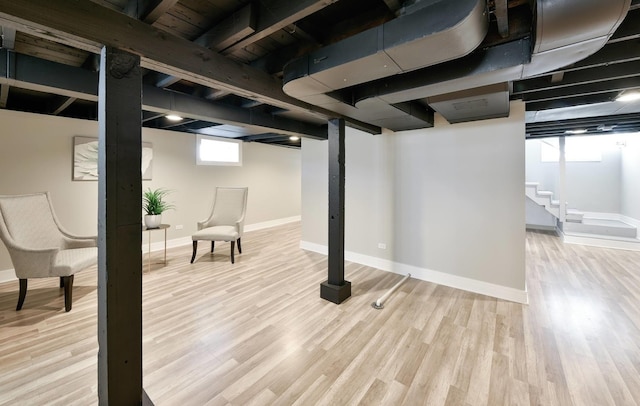 basement featuring light hardwood / wood-style floors