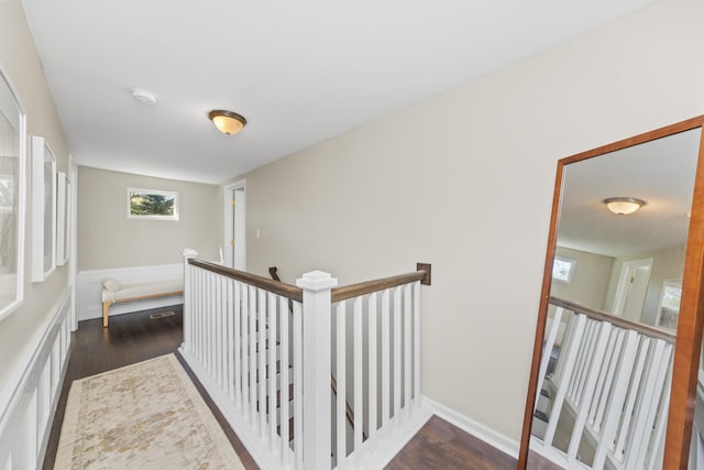 hallway with dark hardwood / wood-style flooring