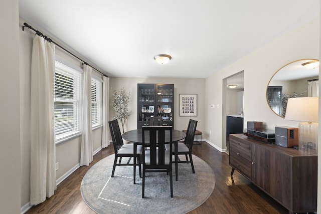 dining space featuring dark hardwood / wood-style flooring