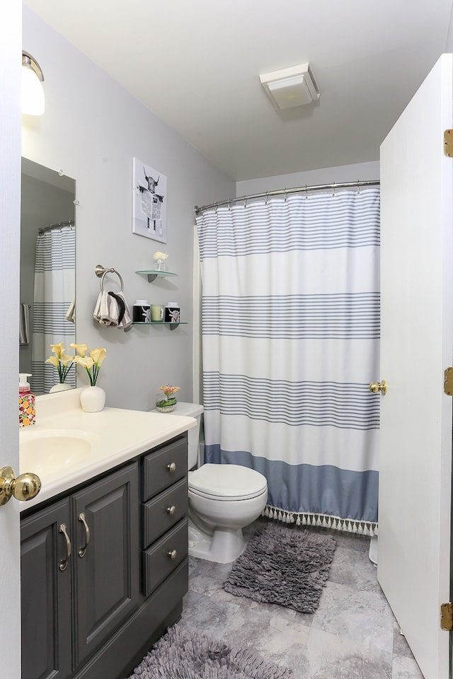 bathroom with vanity and toilet