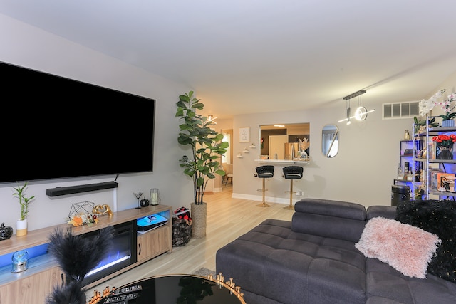 living room featuring light wood-type flooring