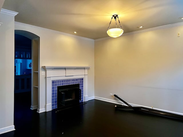 unfurnished living room with ornamental molding and a fireplace