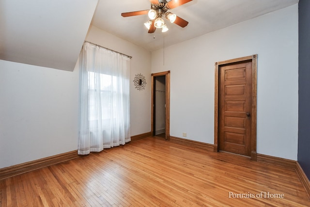 unfurnished bedroom with light wood-type flooring and ceiling fan