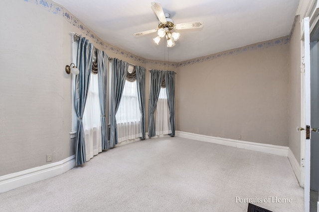 unfurnished room with carpet floors and ceiling fan