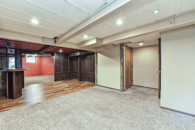 basement featuring hardwood / wood-style flooring