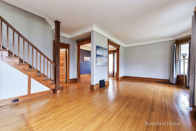 unfurnished living room featuring light hardwood / wood-style flooring